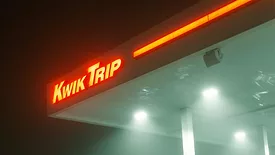 neon kwik trip sign at night