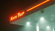 neon kwik trip sign at night