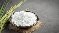 rice flour in bowl next to rice plant_jcomp via freepik.png rice flour
