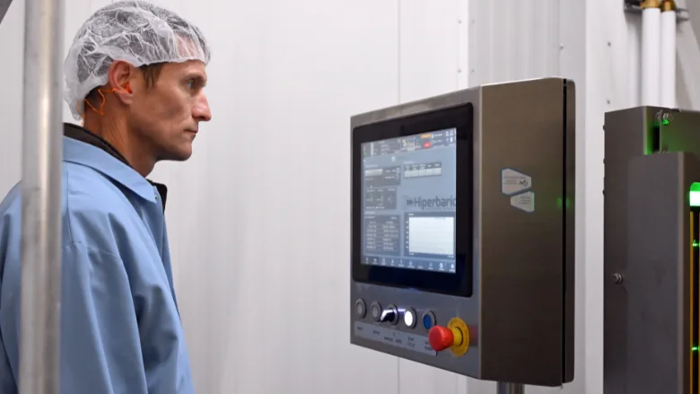 Shade Hughes, FAPC HPP technology manager, operates the center’s commercial-scale Hiperbaric high pressure processing system at Oklahoma State University’s Robert M. Kerr Food & Agricultural Products Center.