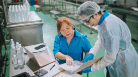 Food safety technicians in processing plant