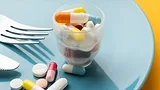 pharmaceuticals on a plate with a fork and knife
