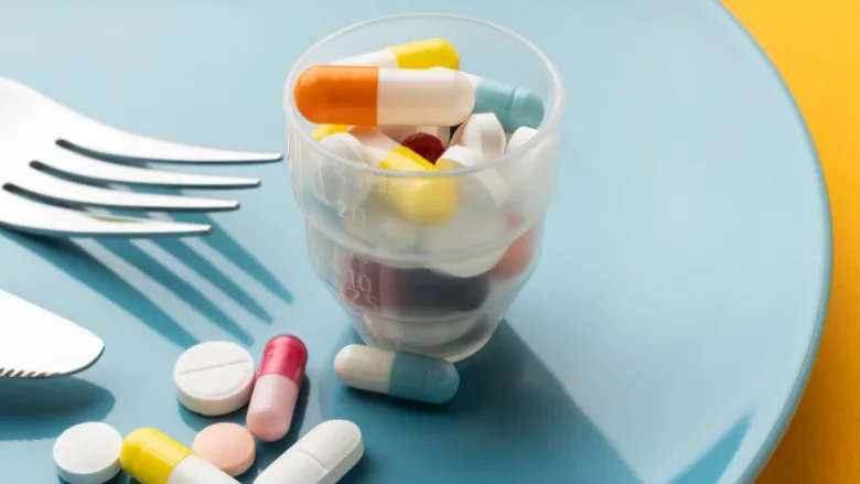 pharmaceuticals on a plate with a fork and knife