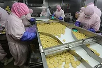 Husi_Food_Company_China_workers-on-line_Reuters.jpg